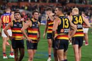 Adelaide players react after the draw